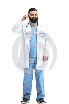 Male doctor, full-length, on a white background, show call sign