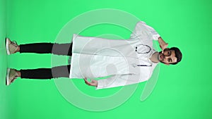 male doctor on a green background. full length shows call sign
