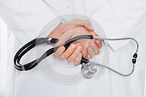 Male Doctor Hand Holding Stethoscope