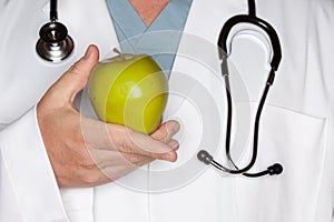 Male Doctor Holding Green Apple