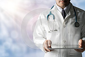 Male Doctor Holding Tablet Computer