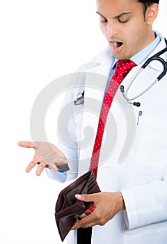 Male doctor holding a wallet and pulling out a card