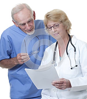 Male doctor looking at female doctor's notes