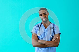 Male doctor or nurse wearing blue scrubs uniform and stethoscope