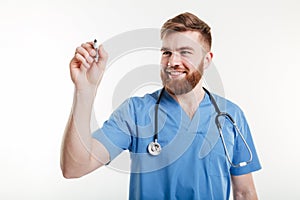 Male doctor or nurse writing with marker on a copyspace