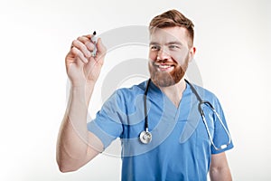 Male doctor or nurse writing with marker on a copyspace