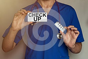 Male doctor prescribes prescription for pills CHECK UP photo