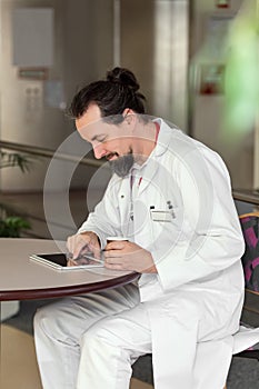 Male doctor is reading something photo