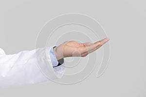 Male doctor`s hand ponting or holding virtual object on open palm