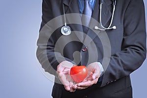 Male doctor showing stethoscope for checkup heart, heart care co