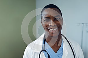 Male doctor smiling in the ward at hospital