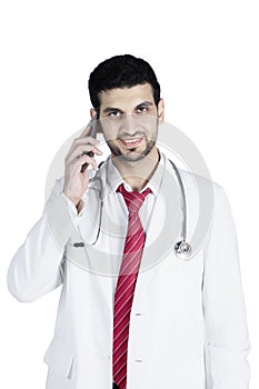 Male doctor speaking on his cellphone