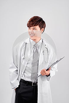 Male Doctor standing with folder, isolated on white background - Image