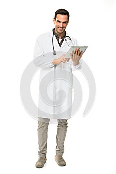 Male doctor with stethoscope and digital tablet photo