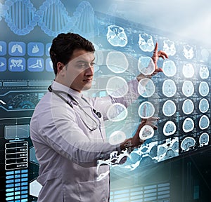 Male doctor studing x-ray image of MRI scan