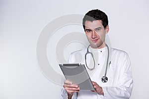 Male doctor with tablet pc