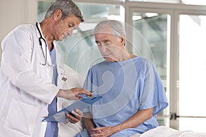 Male doctor taking care of patient photo