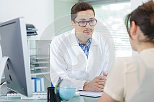 male doctor talking to patient