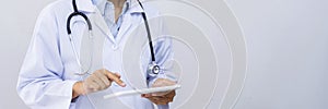 A male doctor undertaking patient consultations and physical examinations at the specialized hospital