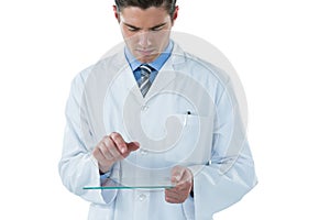 Male doctor using an futuristic digital tablet