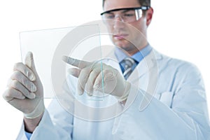 Male doctor using an futuristic digital tablet