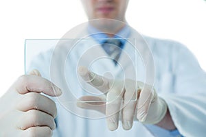 Male doctor using an futuristic digital tablet
