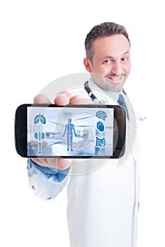 Male doctor using tablet with medical interface