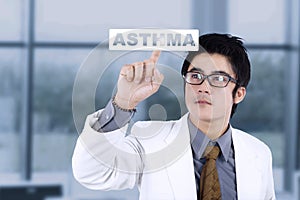 Male doctor with virtual asthma word