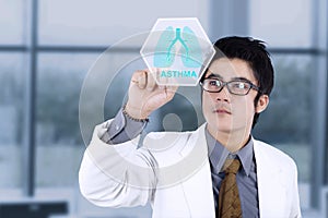 Male doctor with virtual lungs symbol