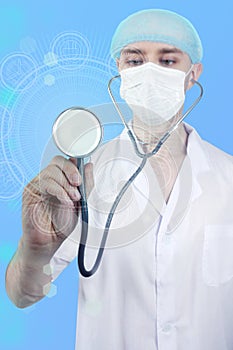 Male doctor on a virtual screen holds a stethoscope, concept of medical care, health, tourism, insurance, health, pediatrics
