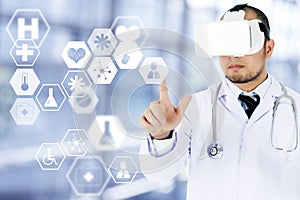 Male Doctor wearing Virtual reality headset touching icon on med