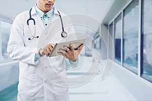 Male Doctor Working on Tablet Computer