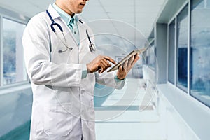 Male Doctor Working on Tablet Computer