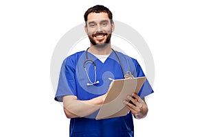 male doctor writing medical report on clipboard