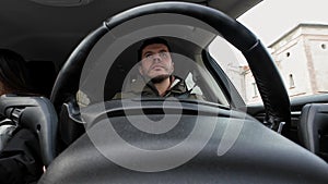 Male driver driving car, inside view