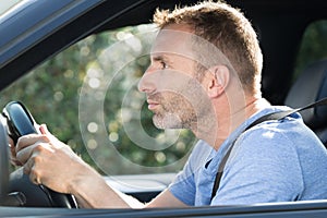 male driver inside car