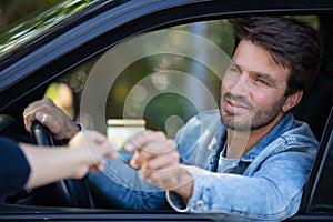 male driver making payment by card