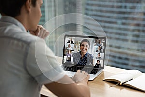 Male employee have webcam online meeting on laptop with colleagues