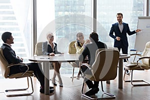 Male employee make presentation at friendly office meeting