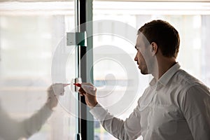 Male employee write on desk developing startup plan