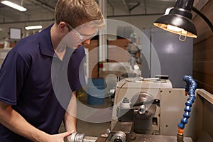 Male Engineer In Factory Using Milling Machine