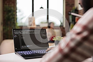 Male IT engineer programming app code