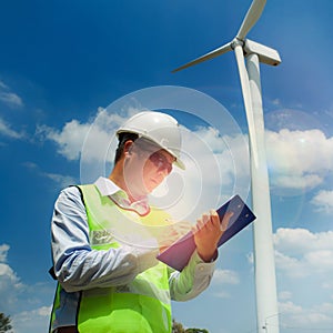 Male Engineer or tecnician at Work wind turbine station,wind ene photo