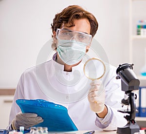 Male entomologist working in the lab on new species