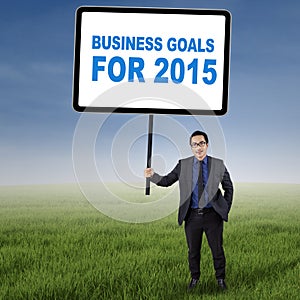Male entrepreneur with business goals for 2015