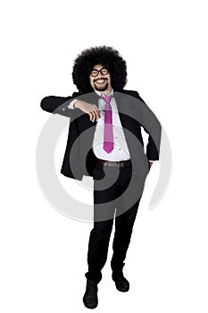 Male entrepreneur with curly hair in studio