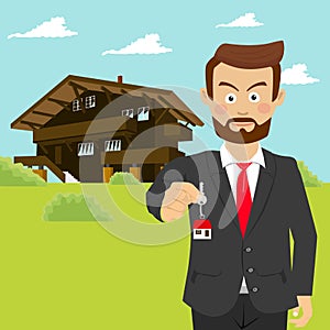 Male estate agent realtor showing house key in front of house