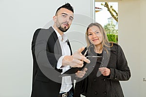 male estate agent showing female client around property