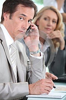 Male executive on cellphone