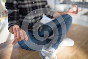 Male executive performing yoga on table